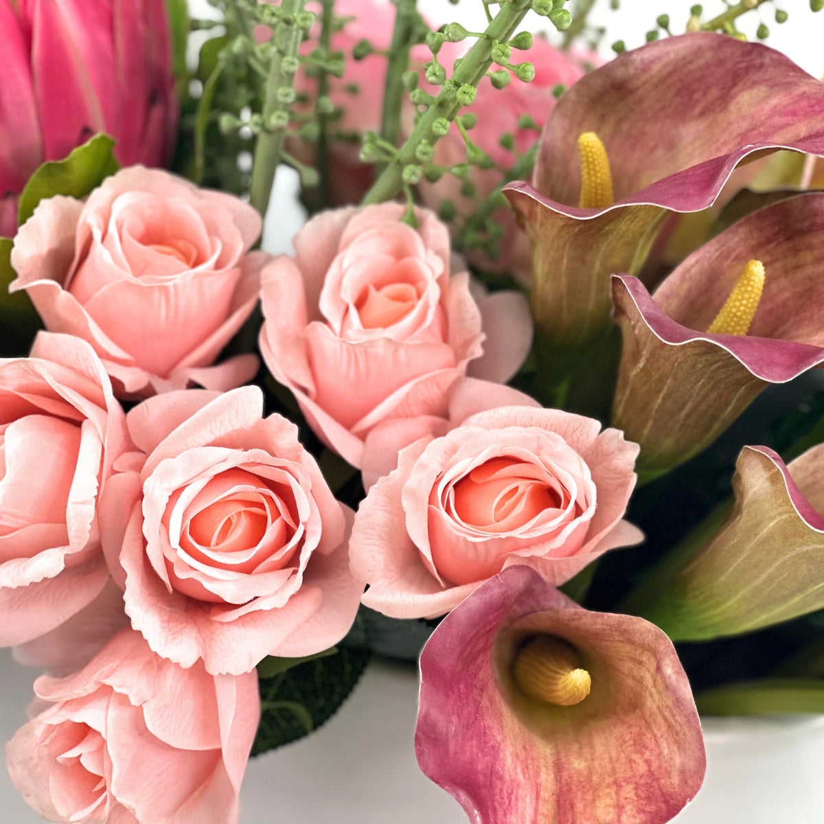 Protea Rose Arum Lily Mix Arrangement in White Ceramic Planter