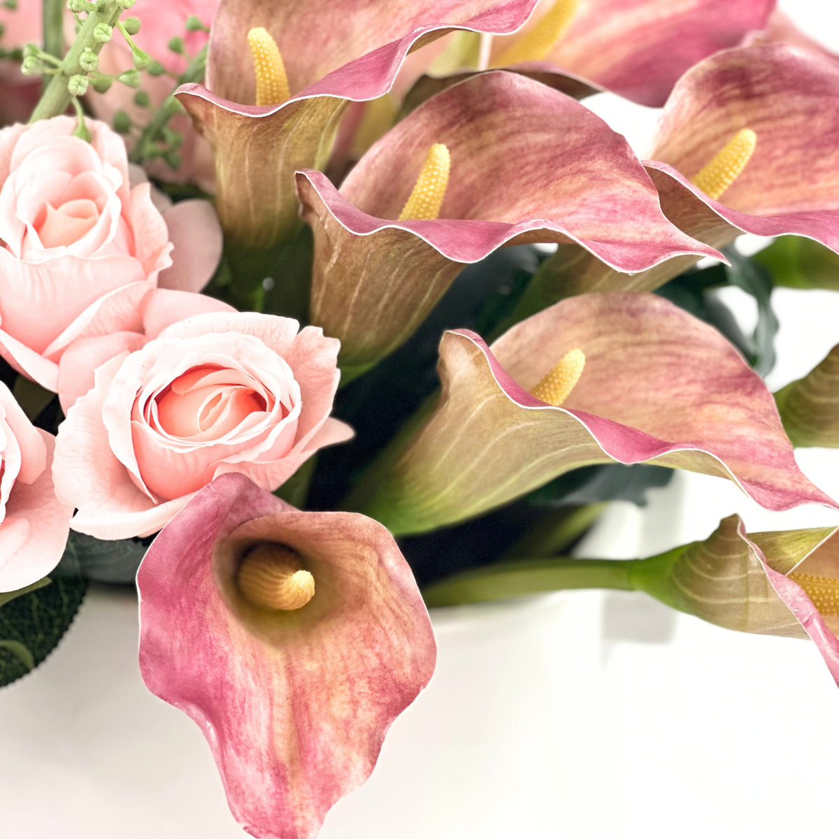 Protea Rose Arum Lily Mix Arrangement in White Ceramic Planter