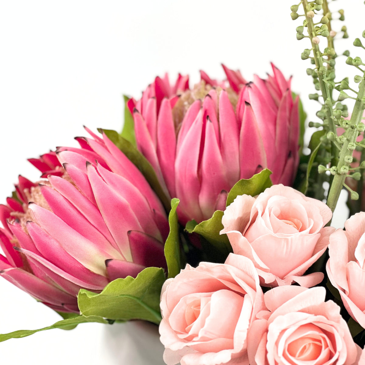 Protea Rose Arum Lily Mix Arrangement in White Ceramic Planter