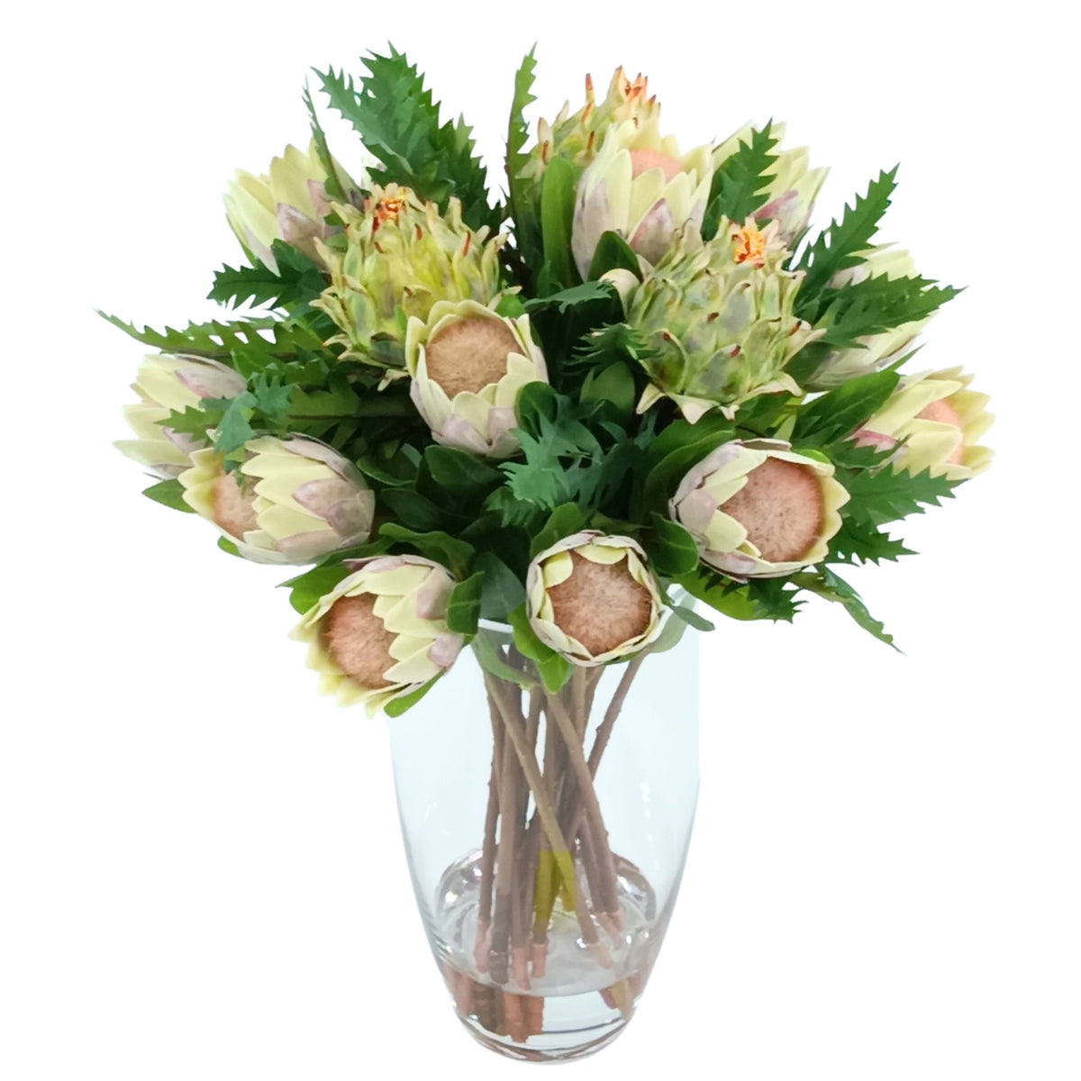 Protea Artichoke Silk Flower Arrangement in Glass Bullet Vase. Front view of this arrangement available from www.plantcouture.co.za.