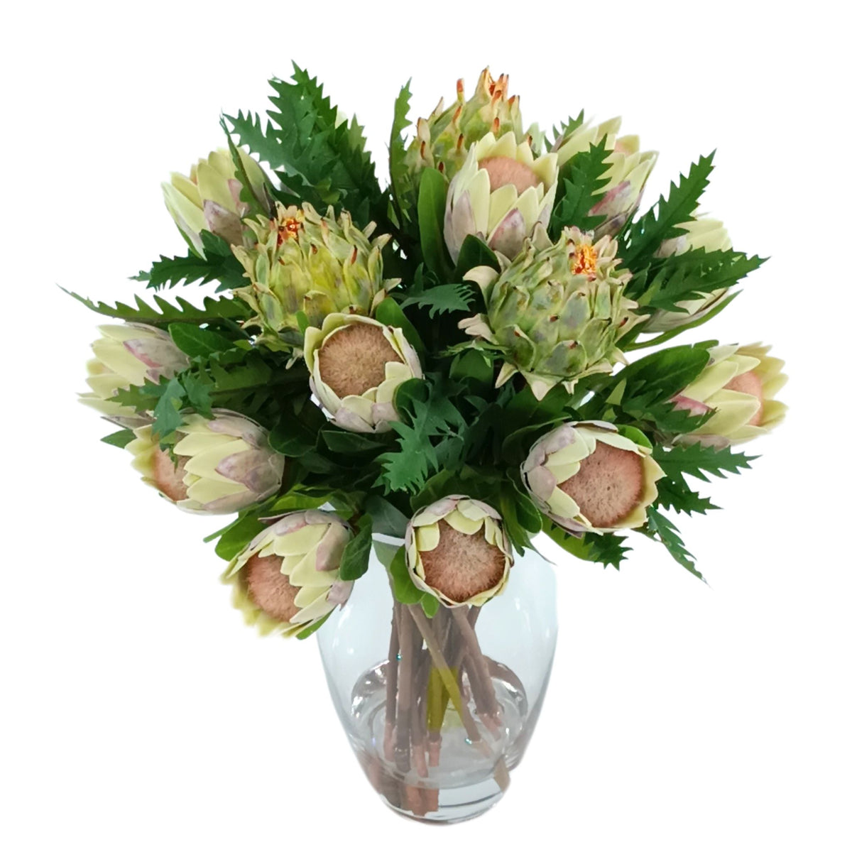 Protea Artichoke Silk Flower Arrangement in Glass Bullet Vase. Front view of this arrangement available from www.plantcouture.co.za.