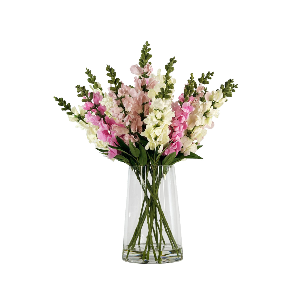 Bouquet of faux pink and white snapdragons in a clear glass vase with faux water on a white background