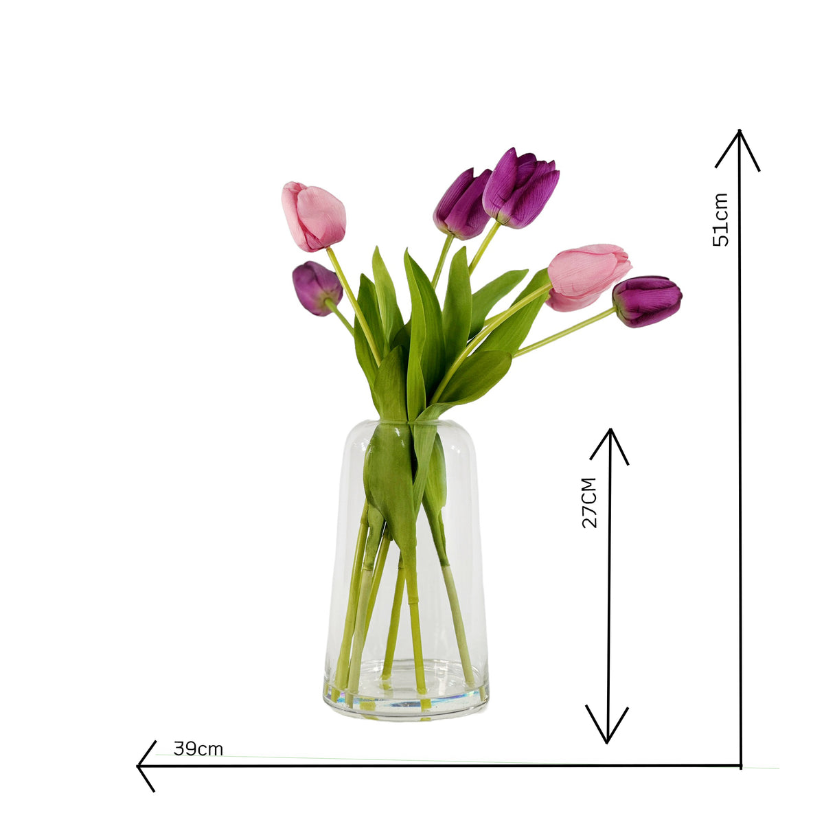 Pink and purple faux tulips in glass vase with faux water on a white background