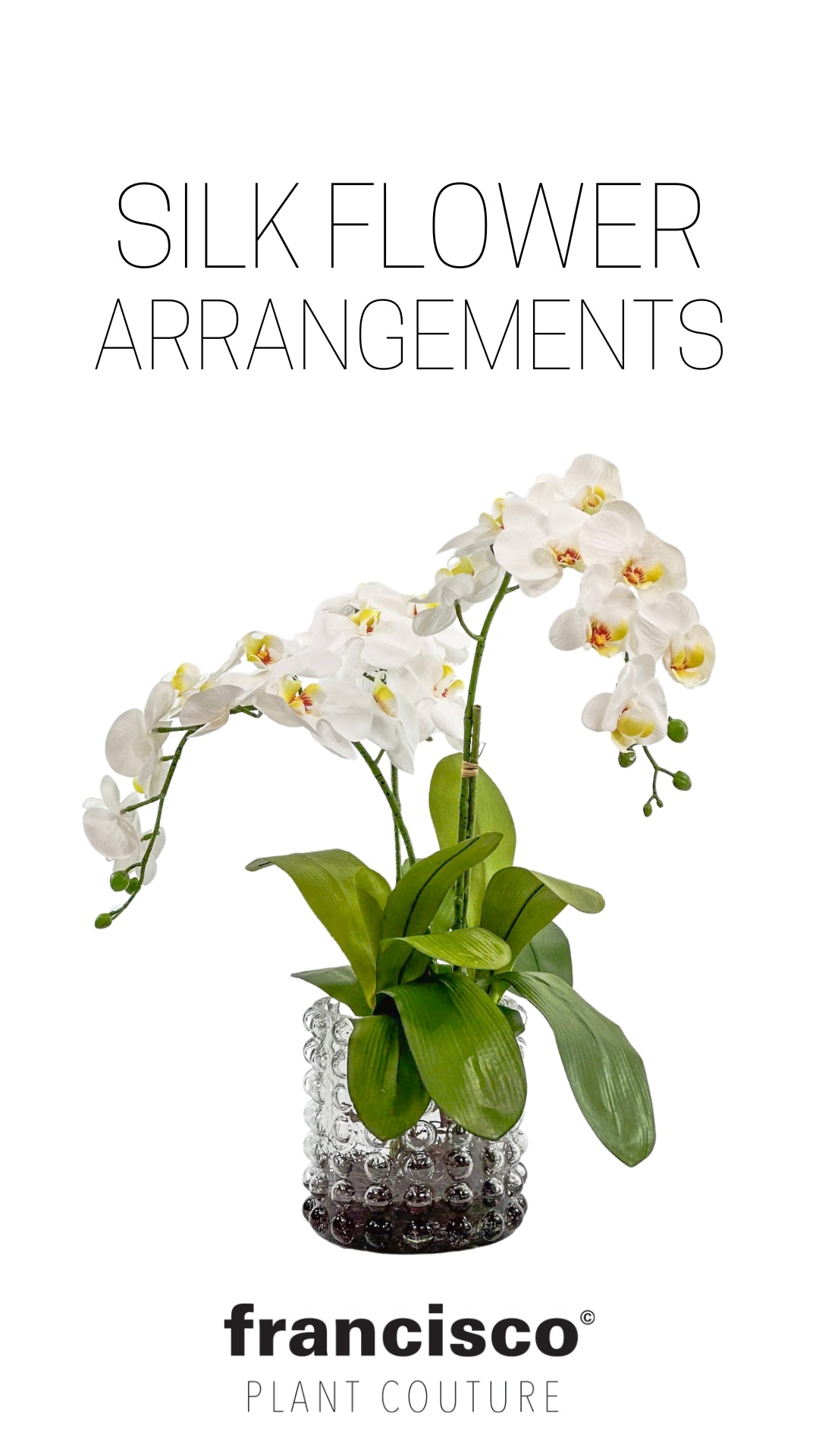 white orchid silk flower arrangement in white bubble glass vase from Plant Couture