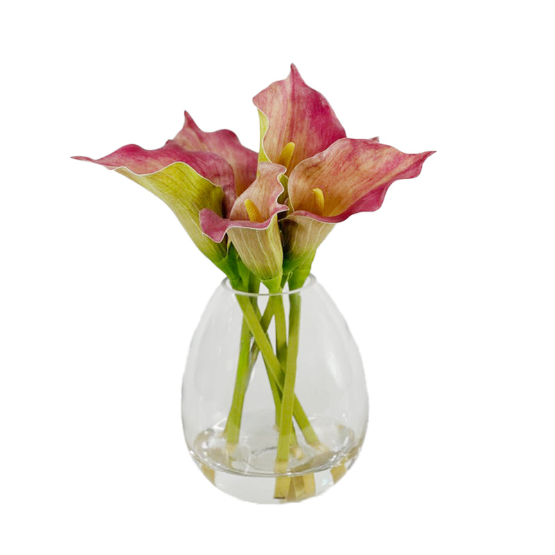 Faux Pink and green Arum Lily arrangement  in a clear glass vase with Faux Water on a white background