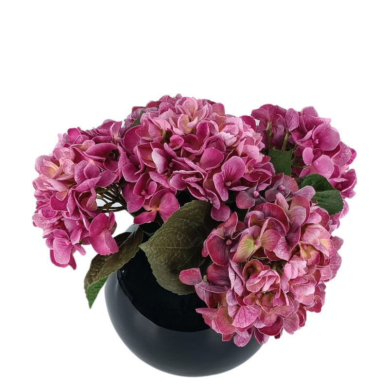 Hydrangea Purple Pink Arrangement in Black Gloss Glass Vase. Top view of silk flowers in vase. Available from www.plantcouture.co.za