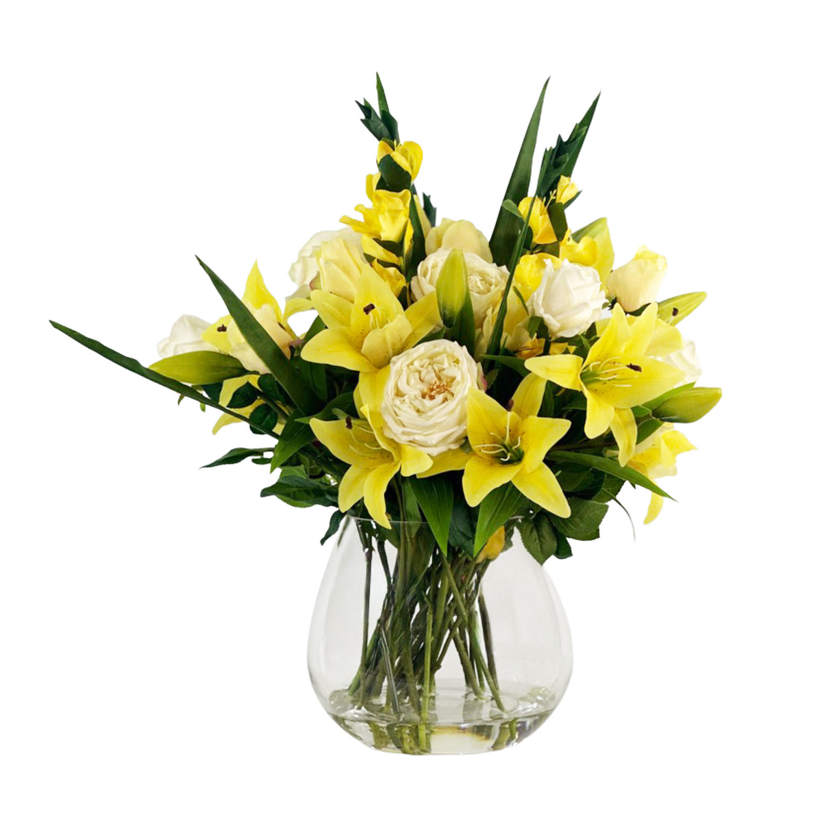 Arrangement of yellow and white faux flowers in a clear vase with faux water on a white background