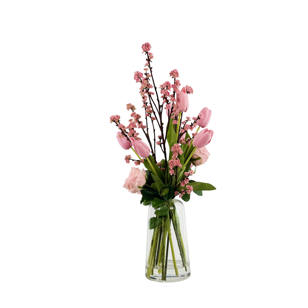 Faux Mixed arrangement with Roses Cherry Blossom and Tulips in Pink set in Clear Glass Helsinki Vase