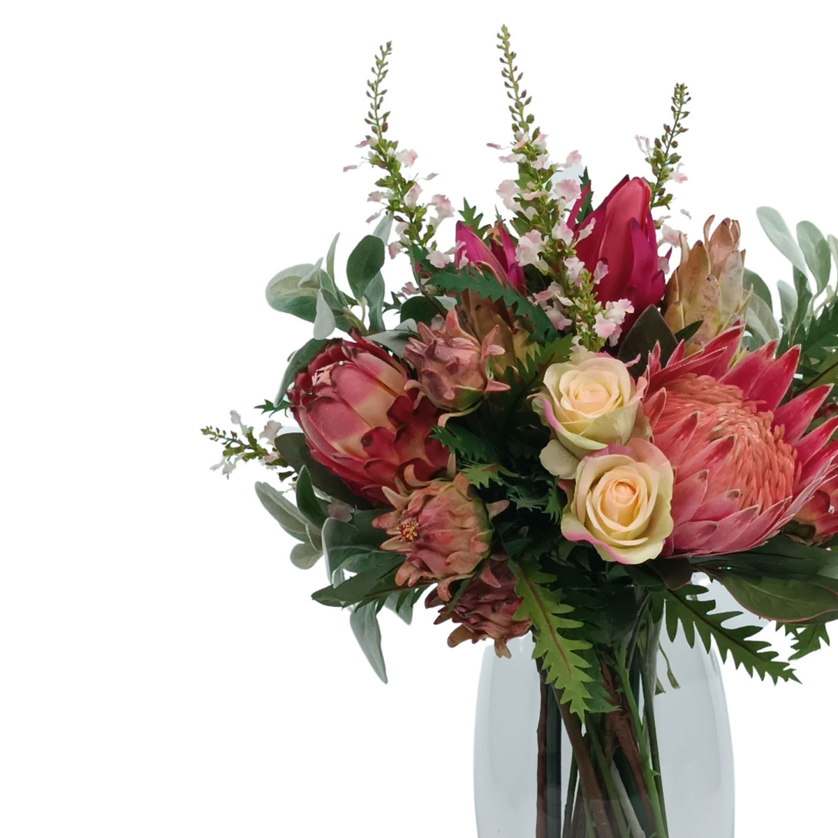 Mix Arrangement Protea Rose Artichoke. Silk flower arrangement available from www.plantcouture.co.za. Front view of arrangement showing shades of pink, white and grey.