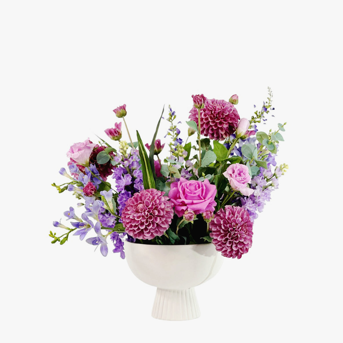 Faux Mix purple Flower arrangement with Dahlia Roses Freezia Snapdragon & Eucaluptus is footed white Ceramic