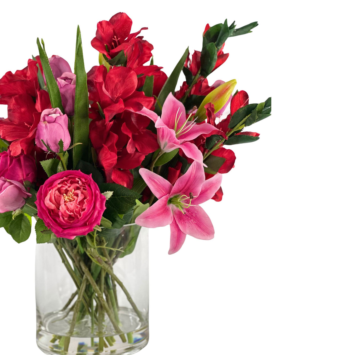 Mix Arrangement Lilly Gladiolus Roses in Glass Vase. Side close up view of the life like silk flower arrangement. Available from Plant Couture.