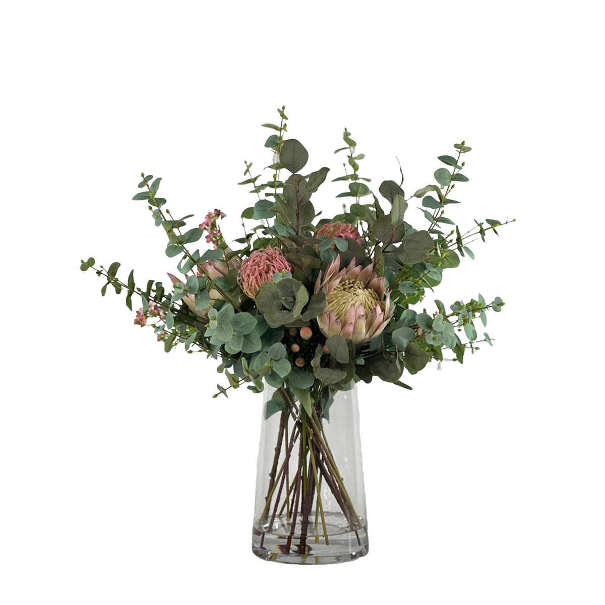 Bouquet of faux Protea pincusion and Eucaluptus with a clear vase with faux water on a white background