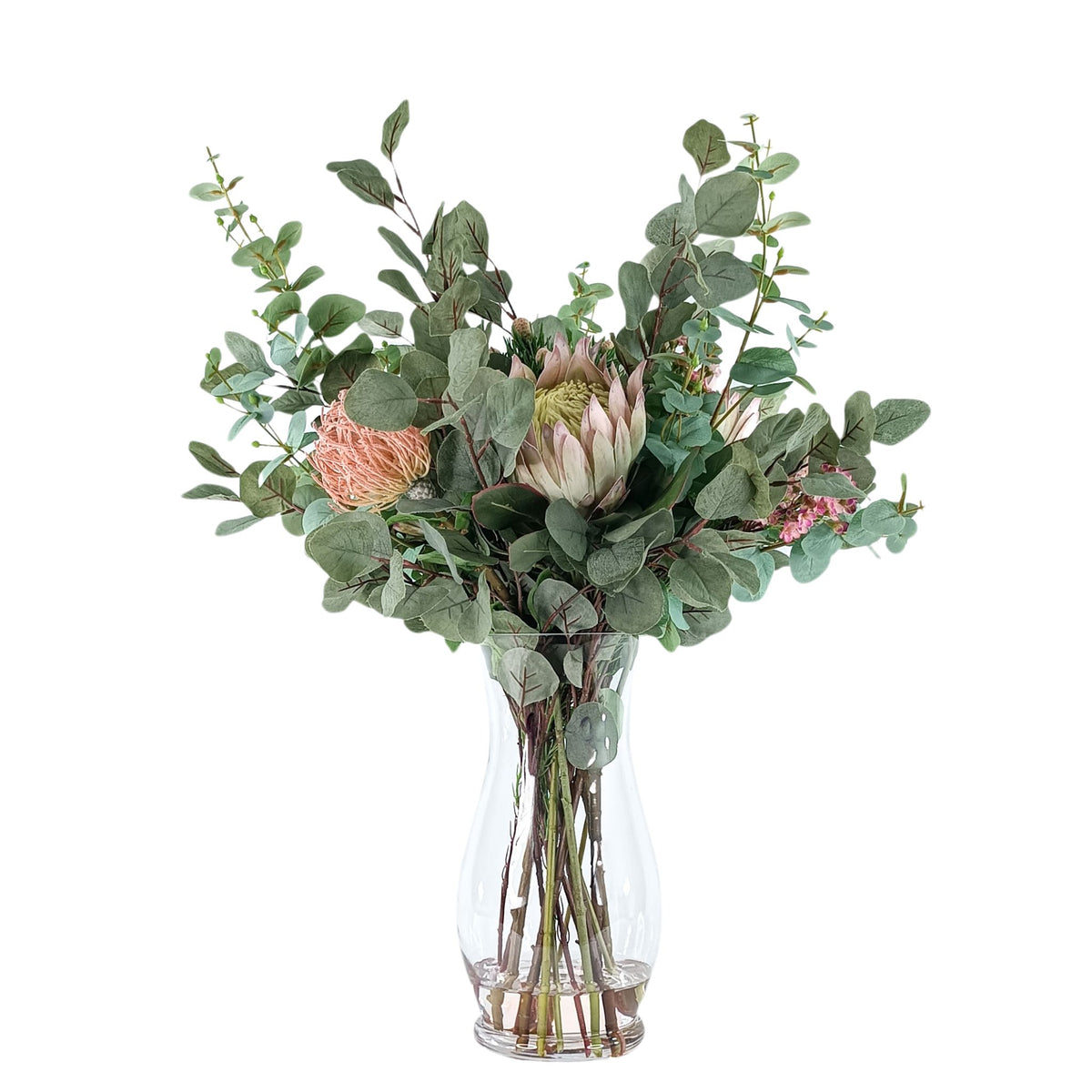 Protea Eucalyptus Mix Arrangement in Glass Vase. Full view of the silk flower arrangement. Available from Plant Couture.