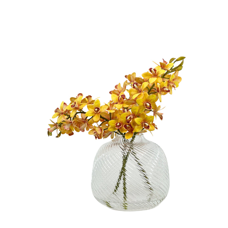Beautiful Artificial Cymbidium Orchid set in faux water in a clear swirl vase