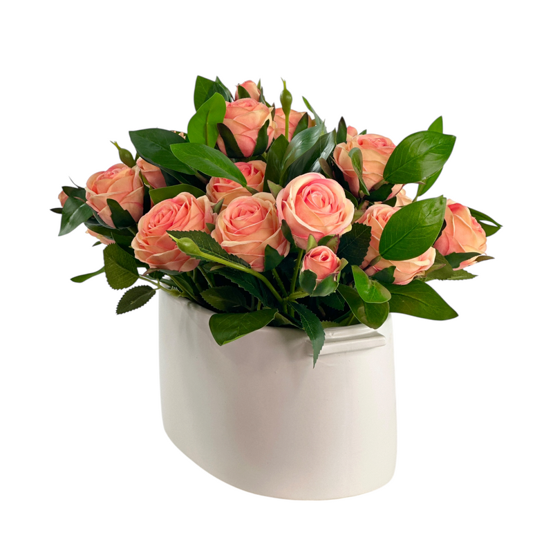 Artificial Peach Roses with foliage in white ceramic pot