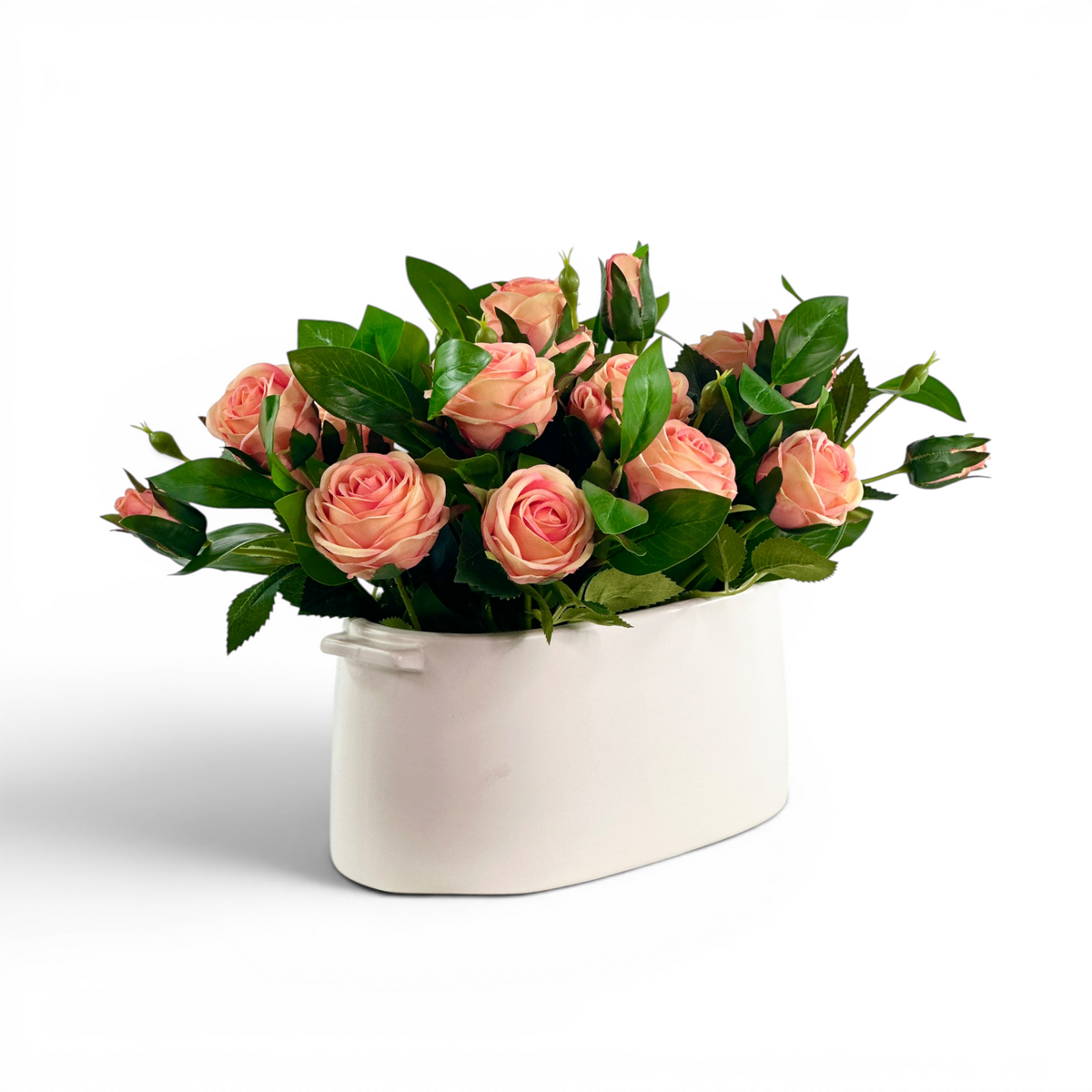 Faux Peach Roses with foliage in white ceramic planter