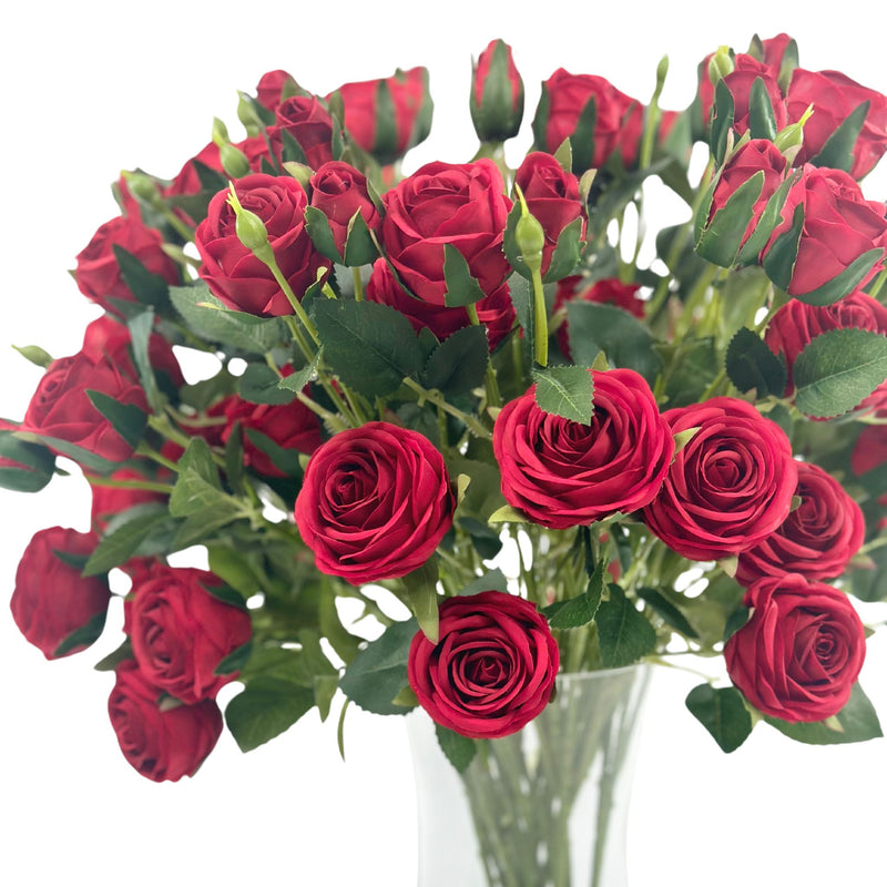 Roses Red Silk Flower Arrangement in Waisted Glass Vase. Top close up view. Plant Couture.