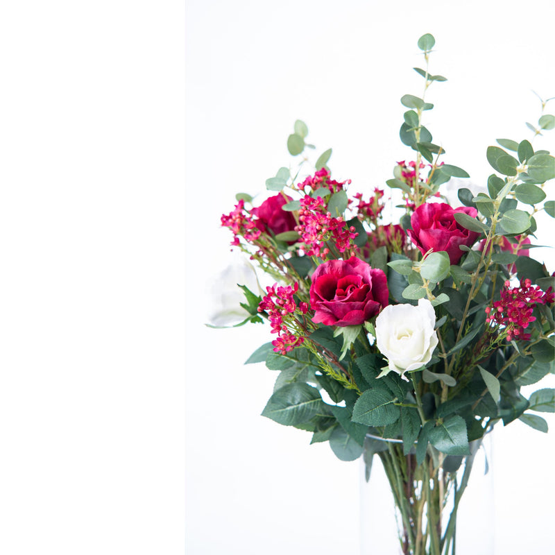 Rose Eucalyptus Arrangement in Glass Vase. Close up view. Available from Plant Couture.