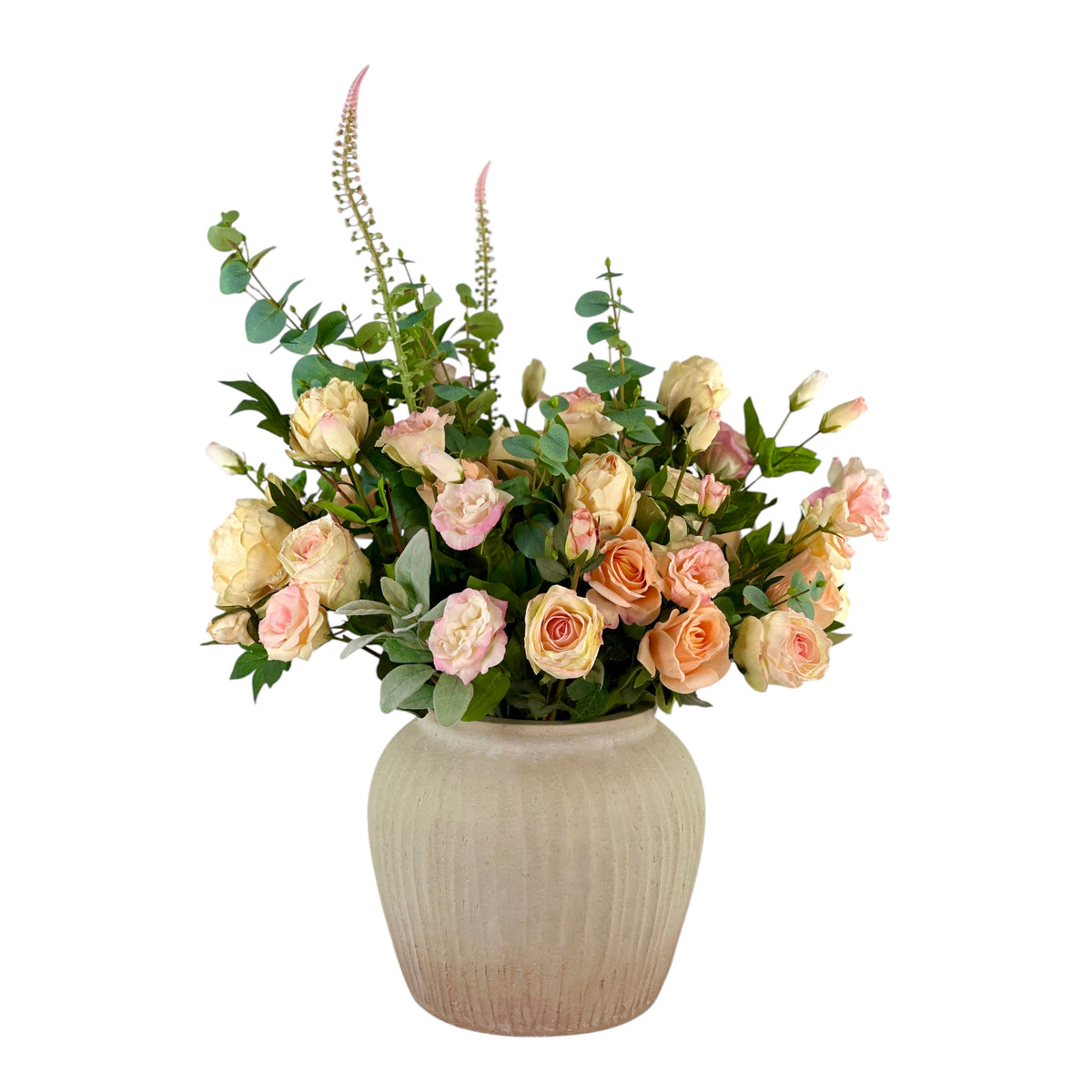 Floral arrangement in a textured vase on a white background